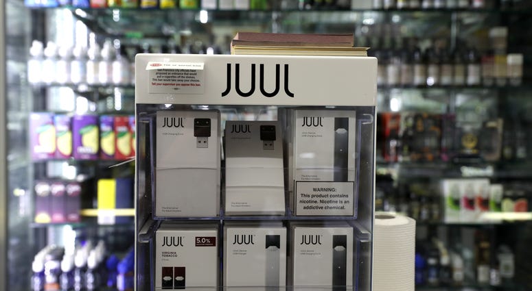 E-cigarettes made by Juul are displayed at Smoke and Gift Shop on June 25, 2019 in San Francisco, California. E-cigarettes made by Juul