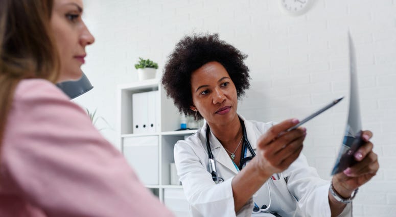 Woman talking with her doctor Woman talking with her doctor