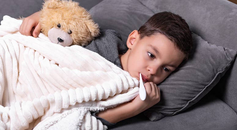 A kid with a fever A kid with a fever
