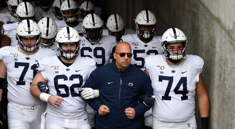 MINNEAPOLIS, MINNESOTA - NOVEMBER 09: Head coach James Franklin of the Penn State Nittany Lions walks his team onto the field before playing against the Minnesota Golden Gophers. Head coach James Franklin of the Penn State Nittany Lions walks his team onto the field before playing against the Minnesota Golden Gophers.