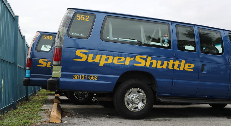 Reports indicate that SuperShuttle will cease operations at the end of the year after 36 years of operation. A SuperShuttle vehicle is seen parked in Miami, Florida on Friday.