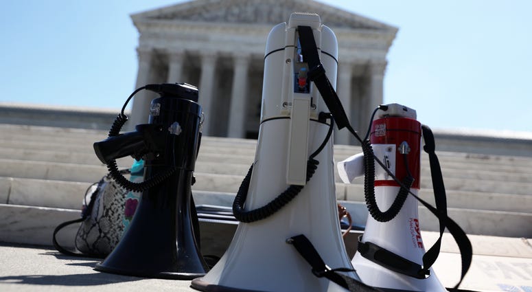 Bullhorns are placed on the ground during a demonstration in front of the U.S. Supreme Court June 29, 2020. In a 5-4 decision, the court ruled a Louisiana law that required abortion doctors need admitting privileges to nearby hospitals unconstitutional. Supreme Court protests