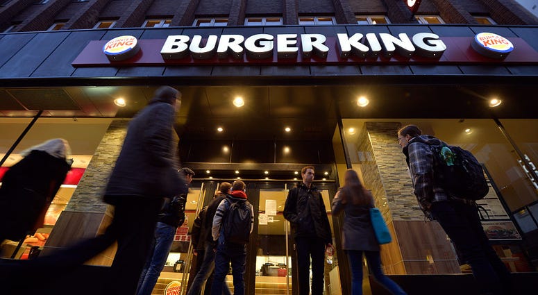 Passersby stand for a temporary closed Burger King restaurant on Nov. 24, 2014 in Frankfurt, Germany. Burger King