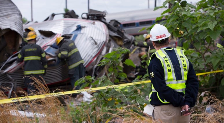 In this handout image supplied by NTSB, NTSB member Robert Sumwalt works on the scene of the Amtrak Train #188 derailment on May 13, 2015 in Philadelphia, Pennsylvania. NTSB