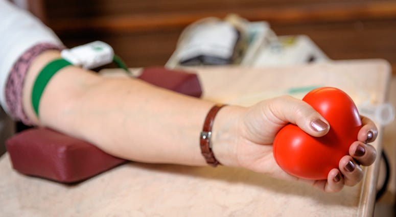 A woman donating blood A woman donating blood