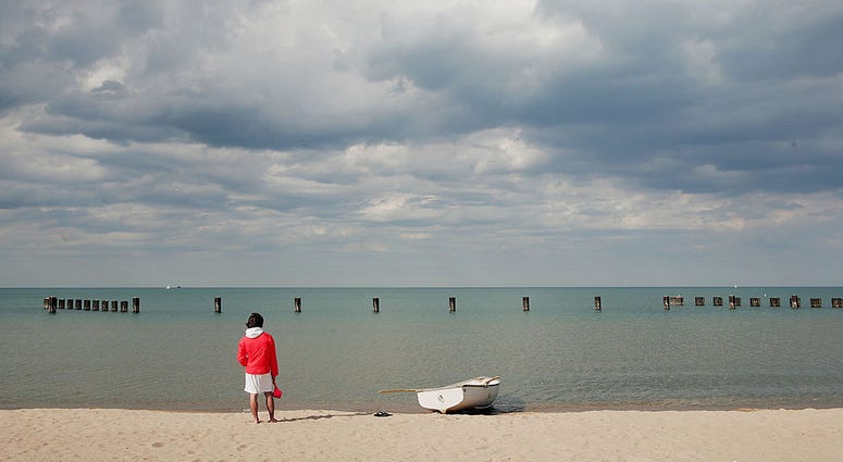 Lifeguard Ben Ingvoldscad watches over the waters of Lake Michigan at North Avenue Beach May 27, 2005 in Chicago, Illinois. Lifeguard Ben Ingvoldscad watches over the waters of Lake Michigan at North Avenue Beach May 27, 2005 in Chicago, Illinois.