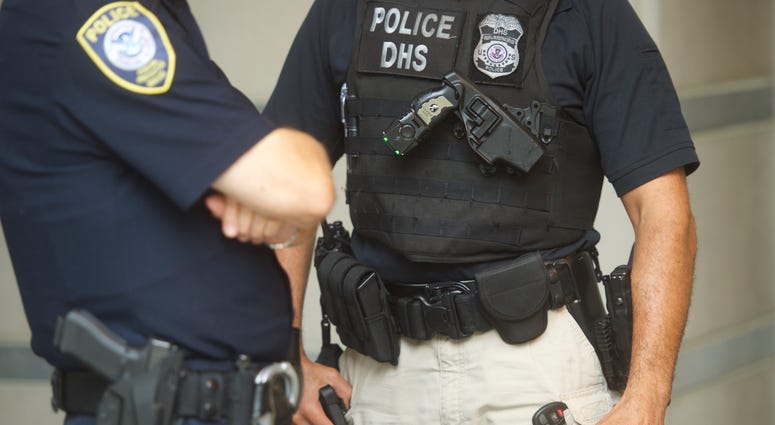 Police officers monitor activity outside the Martin Luther King, Jr. Federal Courthouse, as opening statements are heard in the "Bridgegate" trial on September 19, 2016 in Newark, New Jersey. New Jersey police officers