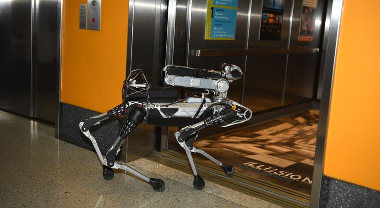 SpotMini Boston Dynamics Marc Raibert's dog-like robot enters the elevator during Genius Gala 6.0 at Liberty Science Center on May 5, 2017 in Jersey City, New Jersey. SpotMini Boston Dynamics Marc Raibert's dog-like robot enters the elevator during Genius Gala 6.0 at Liberty Science Center on May 5, 2017 in Jersey City, New Jersey.