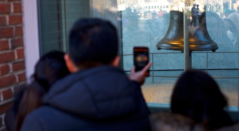 Tourists wait in line to see the Liberty Bell in front of the shuttered Independence Hall after the government shutdown on January 20, 2018 in Philadelphia, Pennsylvania. Tourists in Philadelphia