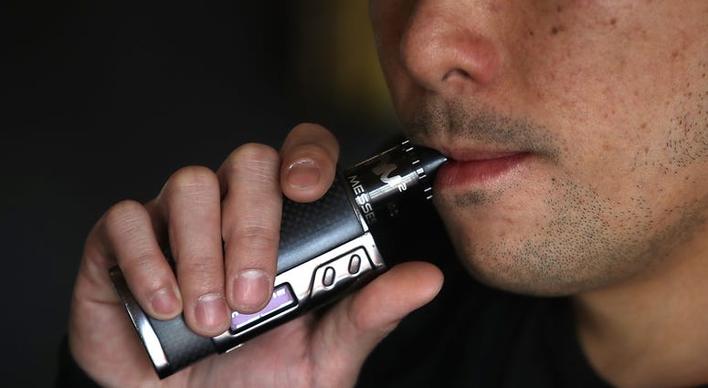 Jeremy Wong smokes an e-cigarette at The Vaping Buddha on January 23, 2018 in South San Francisco, California. Man smokes an e-cigarette