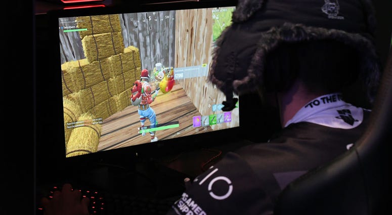 A gamer plays "Fortnite" against Twitch streamer and professional gamer Tyler "Ninja" Blevins during Ninja Vegas '18 at Esports Arena Las Vegas at Luxor Hotel and Casino on April 21, 2018. A gamer plays "Fortnite" against Twitch streamer and professional gamer Tyler "Ninja" Blevins during Ninja Vegas '18 at Esports Arena Las Vegas at Luxor Hotel and Casino on April 21, 2018.