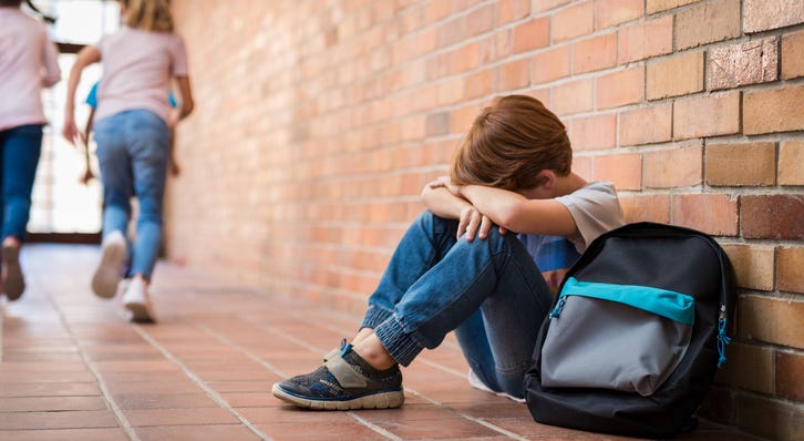 Child unhappy at school. Child unhappy at school.