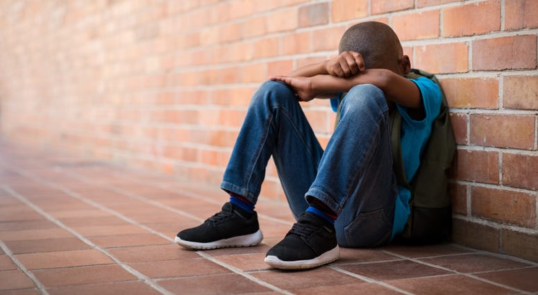 If your child is unhappy and dragging around the house and it lasts for a couple of weeks or more, it's possible that child is depressed, according to Dr. Angela T. Anderson, an adolescent psychiatrist at Children's Hospital of Philadelphia. Young boy sitting alone at school.