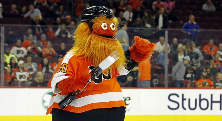 In this Sept. 24, 2018 file photo, the Philadelphia Flyers mascot, Gritty, takes to the ice during the first intermission of the Flyers' preseason NHL hockey game against the Boston Bruins in Philadelphia. In this Sept. 24, 2018 file photo, the Philadelphia Flyers mascot, Gritty, takes to the ice during the first intermission of the Flyers' preseason NHL hockey game against the Boston Bruins in Philadelphia.