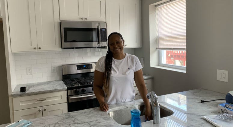 Angela Kraddock in her kitchen. She used the Philly First Home program to buy her first home. Philadelphia's expanded program to help first-time homebuyers is off to a running start. In its first month, more than 100 people have used the program become homeowners, and the process is proving surprisingly easy to navigate.