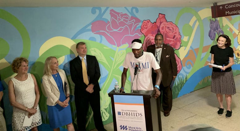 Michael Belo speaking. Officials unveiled a new mural in Septa's suburban station Tuesday, but the artwork was only part of the story. The mural is the product of a program to reduce panhandling by providing low barrier jobs that offer same-day pay. Officials unveiled a new mural in Septa's suburban station Tuesday, but the artwork was only part of the story. The mural is the product of a program to reduce panhandling by providing low barrier jobs that offer same-day pay.