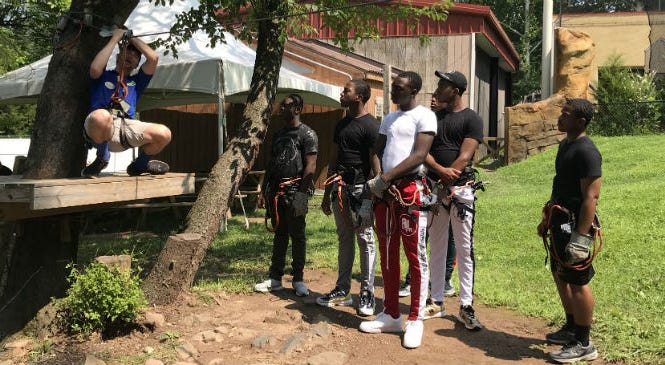 Students from the Glen Mills Schools learn how to zip line during a trip to the Elmwood Park Zoo. Students from the Glen Mills Schools learn how to zip line during a trip to the Elmwood Park Zoo.