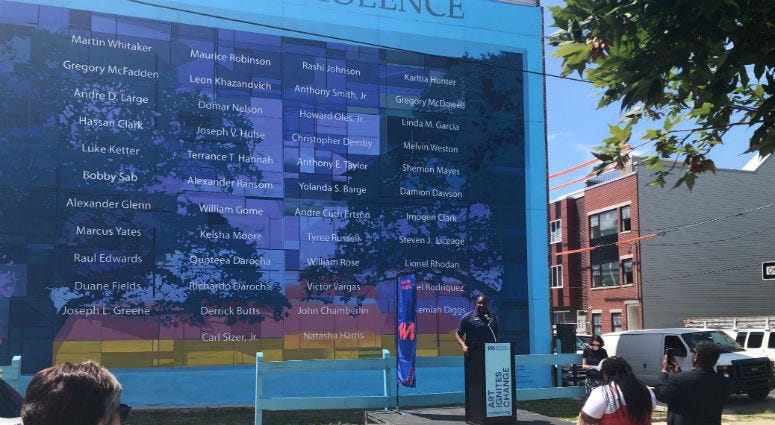 Councilman Kenyatta Johnson at the anti-violence mural that struck community controversy a year ago when a developer mistakenly destroyed that has been officially restored and was dedicated Wednesday. The anti-violence mural that struck community controversy a year ago when a developer mistakenly destroyed it has been officially restored and was dedicated Wednesday.