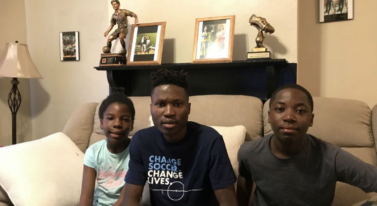 Daniel Yallah (C) and his sister Prosper Yallah (L) and brother Winner Yallah (R). Philadelphia's Unity Cup lets Philadelphians from all over the globe compete against each other in a World Cup style soccer tournament.