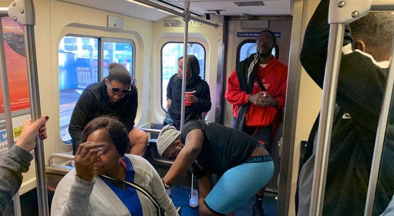 A Market-Frankford Line rider looks away as fellow passengers take part in the No Pants Subway Ride to benefit the homeless. A Market-Frankford Line rider looks away as fellow passengers take part in the No Pants Subway Ride to benefit the homeless.