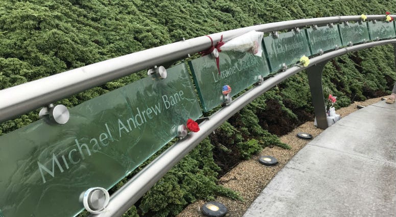 After the ceremony, people placed flowers by plaques with names of the 18 Bucks County residents who died on 9/11. After the ceremony, people placed flowers by plaques with names of the 18 Bucks County residents who died on 9/11.