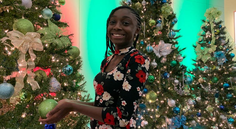 Grace admires the Christmas trees at the KYW Newsradio broadcast center Grace admires the Christmas trees at the KYW Newsradio broadcast center