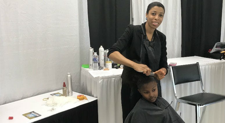 Barbers offered free haircuts for kids during the event. Barbers offered free haircuts for kids during the event.