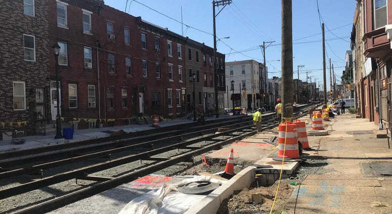 A crew working to install trolley tracks along Richmond St. A crew working to install trolley tracks along Richmond St.