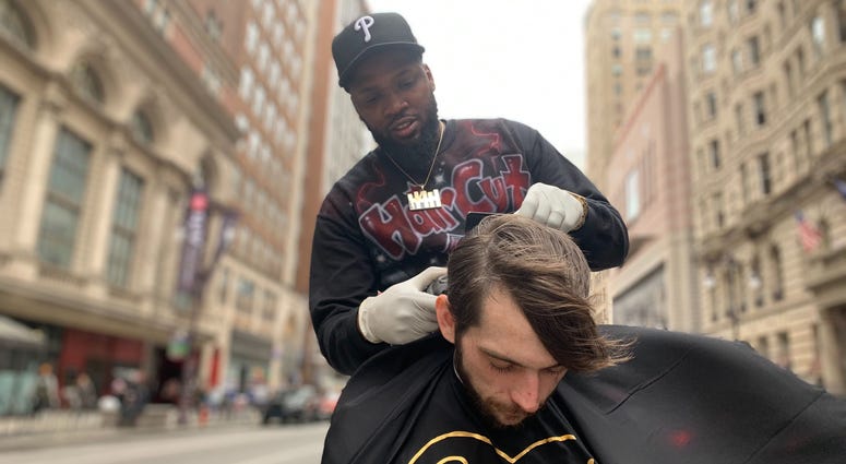 Brennon Jones gives a free haircut in Center City, on the median at Broad and Walnut Streets. Brennon Jones gives a free haircut in Center City, on the median at Broad and Walnut Streets.