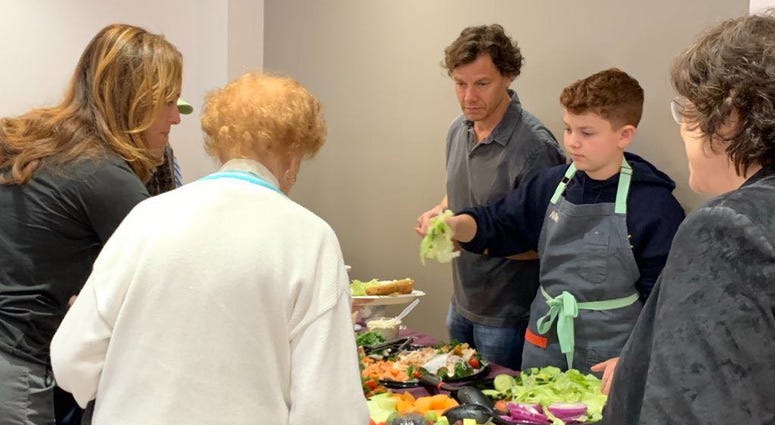 Haverford teen Avner Schwartz serves desserts he made to Holocaust survivors as part of his mitzvah project at the Jewish Family and Children's Services Center in Bala Cynwyd. Haverford teen Avner Schwartz serves desserts he made to Holocaust survivors as part of his mitzvah project at the Jewish Family and Children's Services Center in Bala Cynwyd.