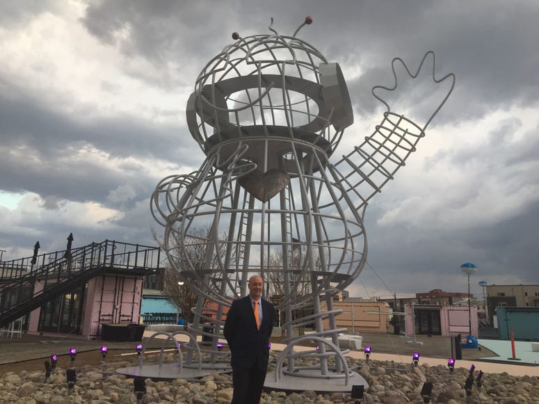 Randy Hope stands in front of Bebot, an art installation originally from Burning Man that now welcomes guests at Pizza Pod Park. Piazza Pod Park