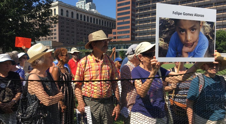 Dozens of seniors packed themselves into a small, makeshift enclosure today, and stood outside in the dangerous heat and humidity to protest migrant family separation and child detention. Dozens of seniors packed themselves into a small, makeshift enclosure today, and stood outside in the dangerous heat and humidity to protest migrant family separation and child detention.
