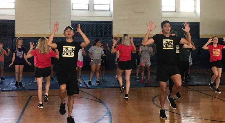 Professional performers from the cast of "Mamma Mia!" taught girls at a Police Athletic League (PAL) cheerleading camp in Port Richmond some moves from the Bucks County Playhouse's current production, July 25, 2019. Bucks County Playhouse