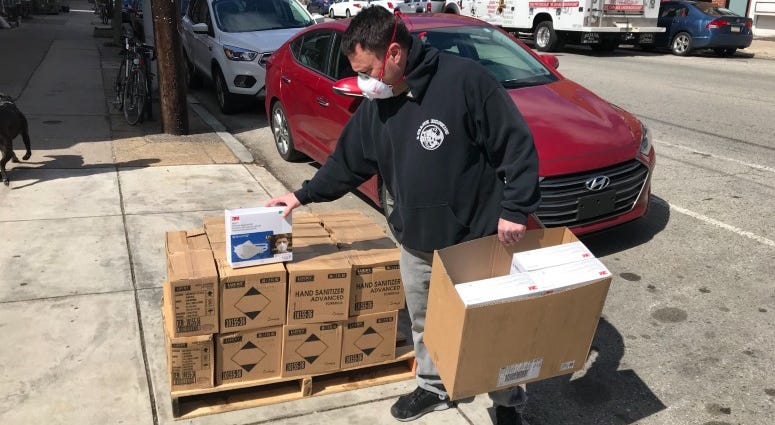 Andy Siegel with a box N95 filtration masks. Andy Siegel with a box N95 filtration masks.