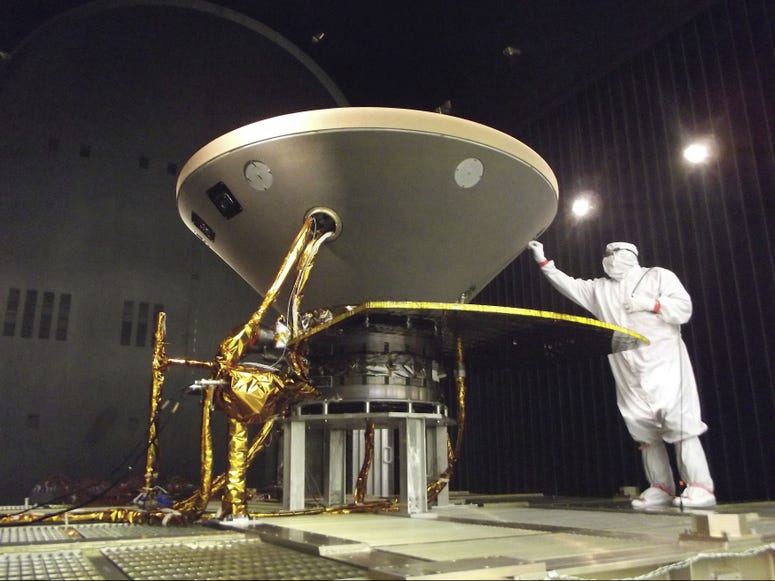 In this 2015 photo made available by NASA, a technician prepares the InSight spacecraft for thermal vacuum testing in its "cruise" configuration for its flight to Mars, simulating the conditions of outer space at Lockheed Martin Space Systems in Denver. In this 2015 photo made available by NASA, a technician prepares the InSight spacecraft for thermal vacuum testing in its "cruise" configuration for its flight to Mars, simulating the conditions of outer space at Lockheed Martin Space Systems in Denver.