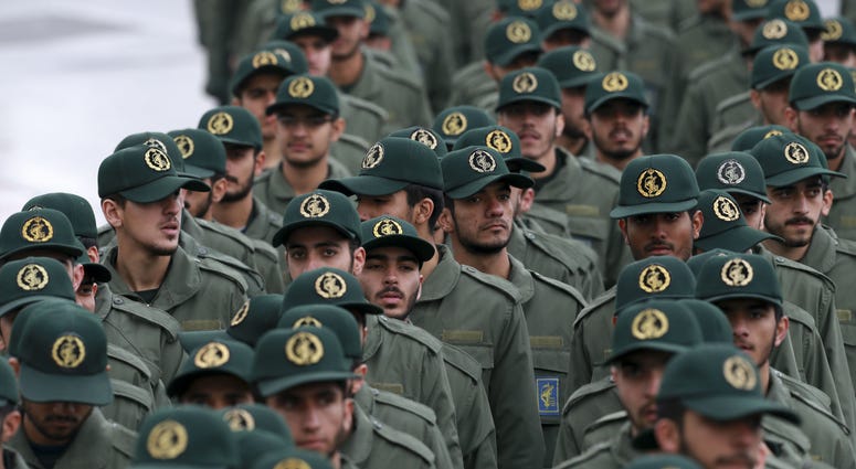 Iranian Revolutionary Guard members arrive for a ceremony celebrating the 40th anniversary of the Islamic Revolution, at the Azadi, or Freedom, Square, in Tehran, Iran. Iranian Revolutionary Guard members arrive for a ceremony celebrating the 40th anniversary of the Islamic Revolution, at the Azadi, or Freedom, Square, in Tehran, Iran.