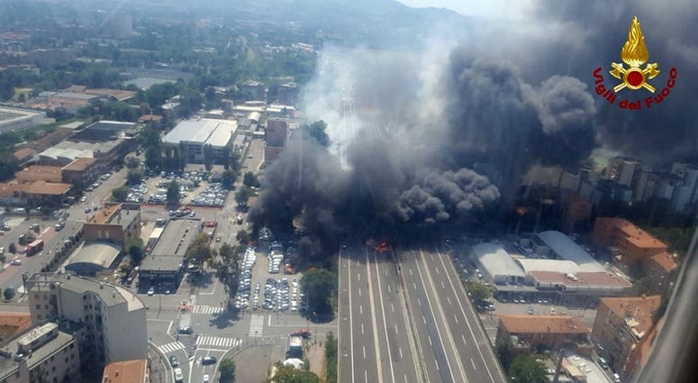 In this photo released by the Italian firefighters, an helicopter view of the explosion on a highway in the outskirts of Bologna, Italy, Monday, Aug. 6, 2018. In this photo released by the Italian firefighters, an helicopter view of the explosion on a highway in the outskirts of Bologna, Italy, Monday, Aug. 6, 2018.