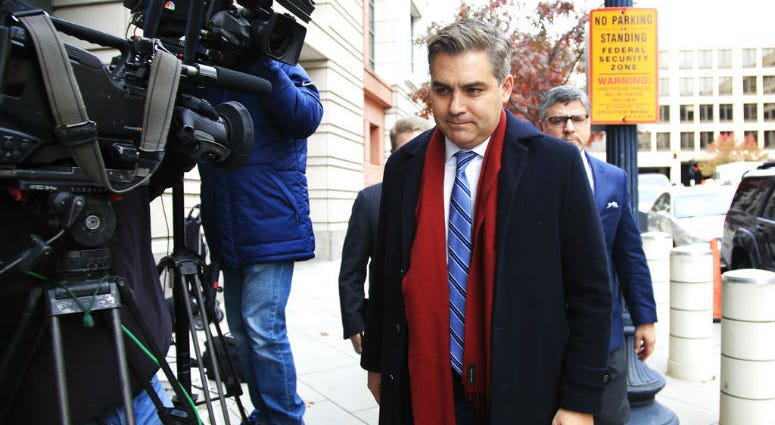 CNN's Jim Acosta walks into federal court in Washington, Wednesday, Nov. 14, 2018, to attend a hearing on legal challenge against President Donald Trump's administration. Trump's administration contends it has "broad discretion" to regulate press access.