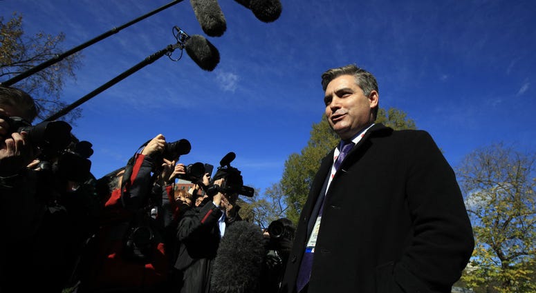 CNN's Jim Acosta speaks to journalists on the North Lawn upon returning back to the White House in Washington, Friday, Nov. 16, 2018. CNN's Jim Acosta speaks to journalists on the North Lawn upon returning back to the White House in Washington, Friday, Nov. 16, 2018.