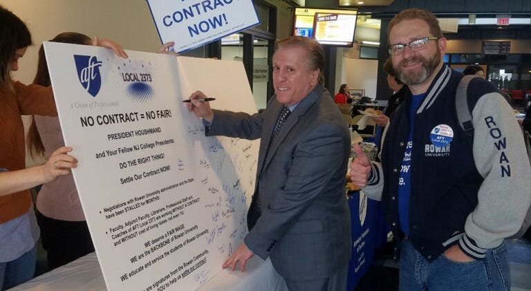 AFT local 2373 President Dr. Joseph Basso and Vice President Gerald Hough sign a petition board at Rowan University. AFT local 2373 President Dr. Joseph Basso and Vice President Gerald Hough sign a petition board at Rowan University.
