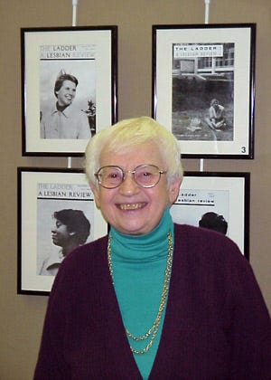 Kay Tobin-Lahusen is shown in front of a collection of her images from the cover of The Ladder. Kay Tobin-Lahusen is shown in front of a collection of her images from the cover of The Ladder.