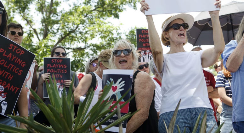 People at the Keep Families Together rally, including Marsha Gore, right, and Claudia Short, cheer as the son of Holocaust survivors speaks about the importance of offering asylum in the South Plaza of the Oklahoma State Capitol Building in Oklahoma City. People at the Keep Families Together rally, including Marsha Gore, right, and Claudia Short, cheer as the son of Holocaust survivors speaks about the importance of offering asylum in the South Plaza of the Oklahoma State Capitol Building in Oklahoma City.