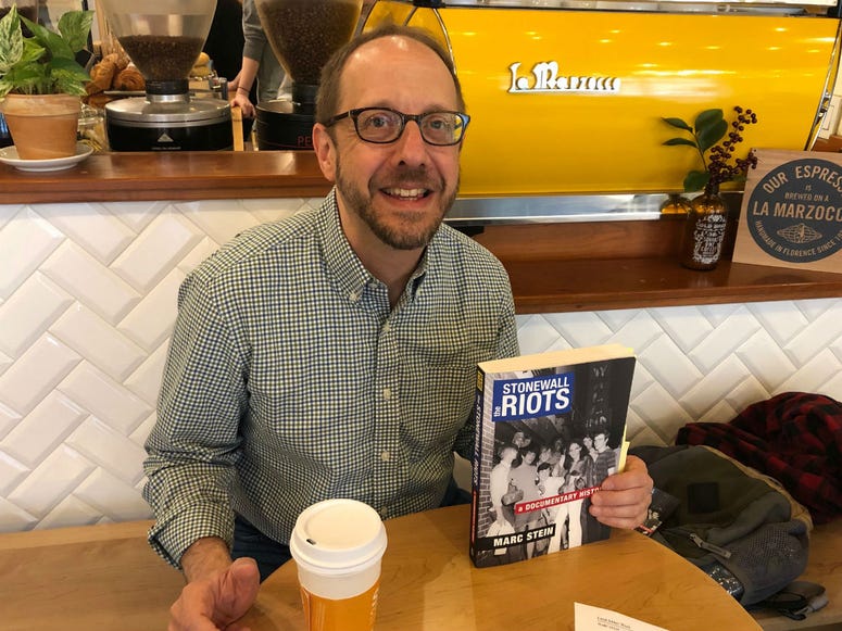 Historian Marc Stein is shown with his book "The Stonewall Riots: A Documentary History." Historian Marc Stein is shown with his book "The Stonewall Riots: A Documentary History."
