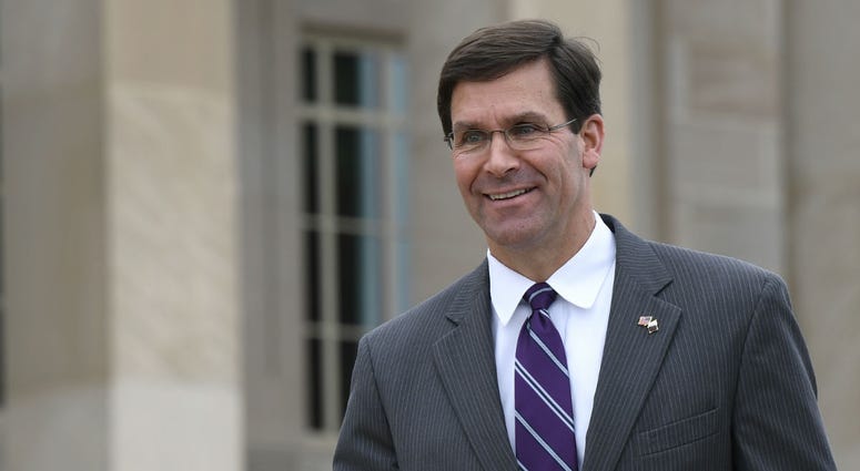 In this July 8, 2019, photo, acting Secretary of Defense Mark Esper waits for the arrival of Qatar's Emir Sheikh Tamim bin Hamad Al Thani to the Pentagon. In this July 8, 2019, photo, acting Secretary of Defense Mark Esper waits for the arrival of Qatar's Emir Sheikh Tamim bin Hamad Al Thani to the Pentagon.