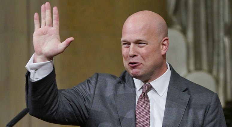 Acting Attorney General Matthew Whitaker gestures after speaking at the Dept. of Justice's Annual Veterans Appreciation Day Ceremony, Thursday, Nov. 15, 2018, at the Justice Department in Washington. Acting Attorney General Matthew Whitaker gestures after speaking at the Dept. of Justice's Annual Veterans Appreciation Day Ceremony, Thursday, Nov. 15, 2018, at the Justice Department in Washington.