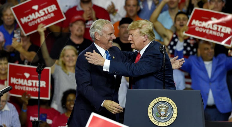 President Donald Trump greets Gov. Henry McMaster during a rally to show support for the governor at Airport High School, Monday, June 25, 2018, in West Columbia, S.C. President Donald Trump greets Gov. Henry McMaster during a rally to show support for the governor at Airport High School, Monday, June 25, 2018, in West Columbia, S.C.