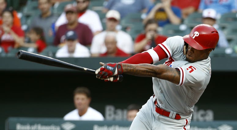 Philadelphia Phillies' Nick Williams hits a ground ball during the third inning of the team's baseball game against the Baltimore Orioles, Thursday, July 12, 2018, in Baltimore. Cesar Hernandez scored on the play. Philadelphia Phillies' Nick Williams hits a ground ball during the third inning of the team's baseball game against the Baltimore Orioles, Thursday, July 12, 2018, in Baltimore. Cesar Hernandez scored on the play.