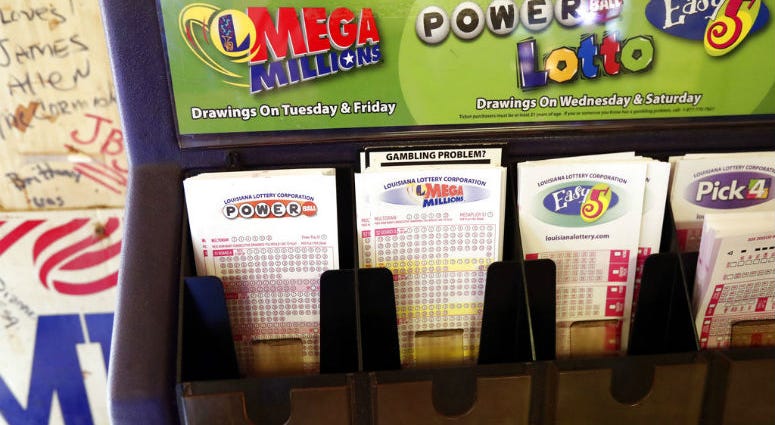 In this Tuesday, Oct. 23, 2018 file photo, lottery forms for Louisiana Mega Millions, Powerball and other lottery games fill the drawer at The World Bar and Grill, in Delta, La., a few miles from the Mississippi-Louisiana state line.