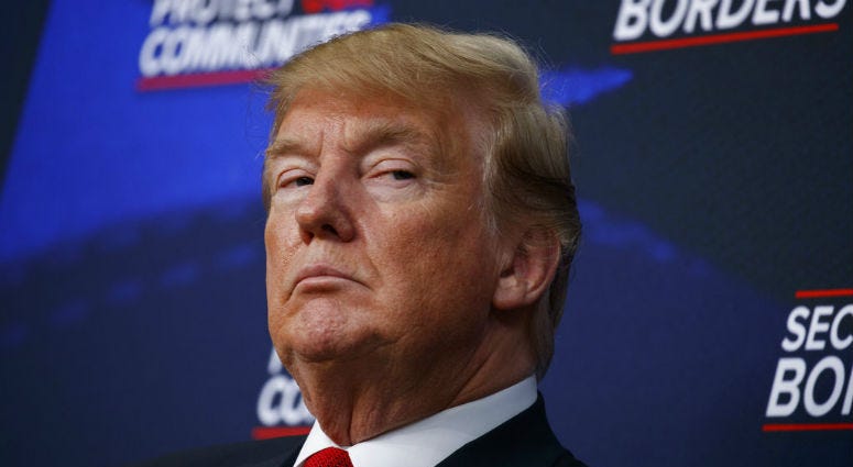 In this June 22, 2018 file photo, President Donald Trump listens during an event on immigration alongside family members affected by crime committed by undocumented immigrants, at the South Court Auditorium on the White House complex in Washington.