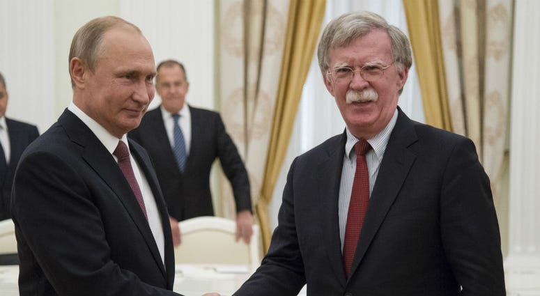 Russian President Vladimir Putin, left, shakes hands with U.S. National security adviser John Bolton during their meeting in the Kremlin in Moscow, Russia, Wednesday, June 27, 2018. Russian President Vladimir Putin, left, shakes hands with U.S. National security adviser John Bolton during their meeting in the Kremlin in Moscow, Russia, Wednesday, June 27, 2018.